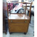 An early 20thC mahogany framed hall seat with bar supports,