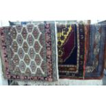 Three rugs: to include a Semnan example with repeating gul motifs on a beige ground 47'' x 23''