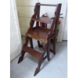 A mid 20thC mahogany metamorphic library chair with four tread steps,