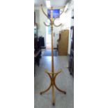 A 20thC beech framed demi-lune bentwood hat/coat stand,