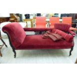 An Edwardian showwood framed red fabric upholstered chaise longue,