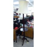 A modern mahogany standard lamp, incorporating a tray table,