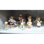 Twelve Goebel Hummel china figures: to include a young boy,