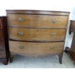 An early 19thC mahogany three drawer bow front dressing chest,