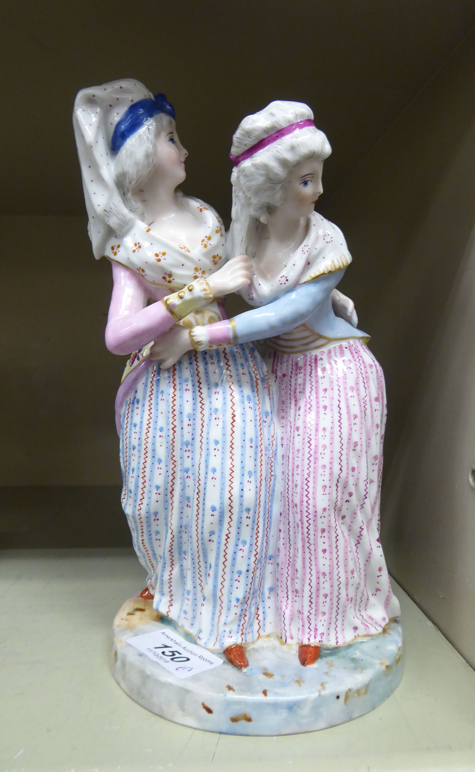 An early/mid 20thC Bavarian porcelain group, two women wearing long dresses,