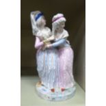 An early/mid 20thC Bavarian porcelain group, two women wearing long dresses,