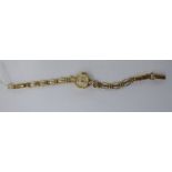 A lady's Regency 9ct gold oval cased wristwatch, on an open tablet link bracelet,