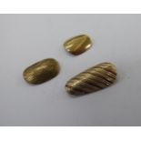 Three 9ct gold false finger nails 11