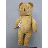 A 1950s Golden fur fabric straw filled Teddy bear with mobile limbs 14''h OS4