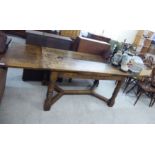 An early 20thC Old English style oak draw leaf dining table,