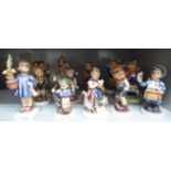 Thirteen Goebel Hummel china figures: to include a young boy delivering letters 4.