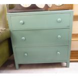 An early/mid 20thC green painted pine, three drawer dressing chest,