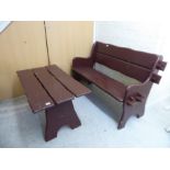 A brown painted wooden garden bench of slatted construction 47''w;