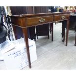 An early 20thC mahogany finished side table with two in-line drawers, raised on square,