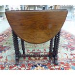 A late Victorian mahogany Sutherland table with D-shaped fall flaps,