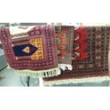 Three rugs: to include a Bokhara with elephant foot motifs on a red ground 38'' x 31'' HSL