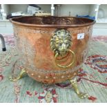 A late Victorian copper and brass log bin,
