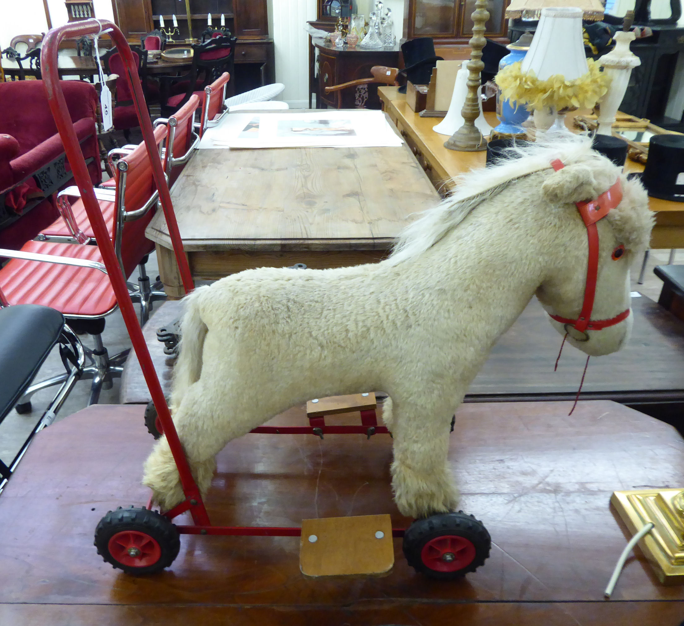 A 1960s fur fabric push-along pony,