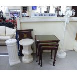 Small furniture: to include a nesting set of three mid 20thC mahogany framed occasional tables,