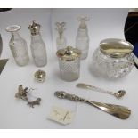 Silver capped dressing table items,