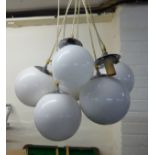 Interior lighting: to include a 1970s hanging centre light with seven white glass ball design