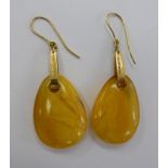 A pair of 18ct gold earrings with amber coloured teardrop shaped pendants 11