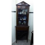 An Edwardian crossbanded and string inlaid mahogany two section corner cabinet with two glazed