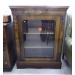 A late Victorian string and marquetry walnut pier cabinet with a glazed door, enclosing two shelves,