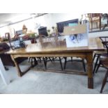 A modern reproduction of an Old English style, oak draw leaf dining table,