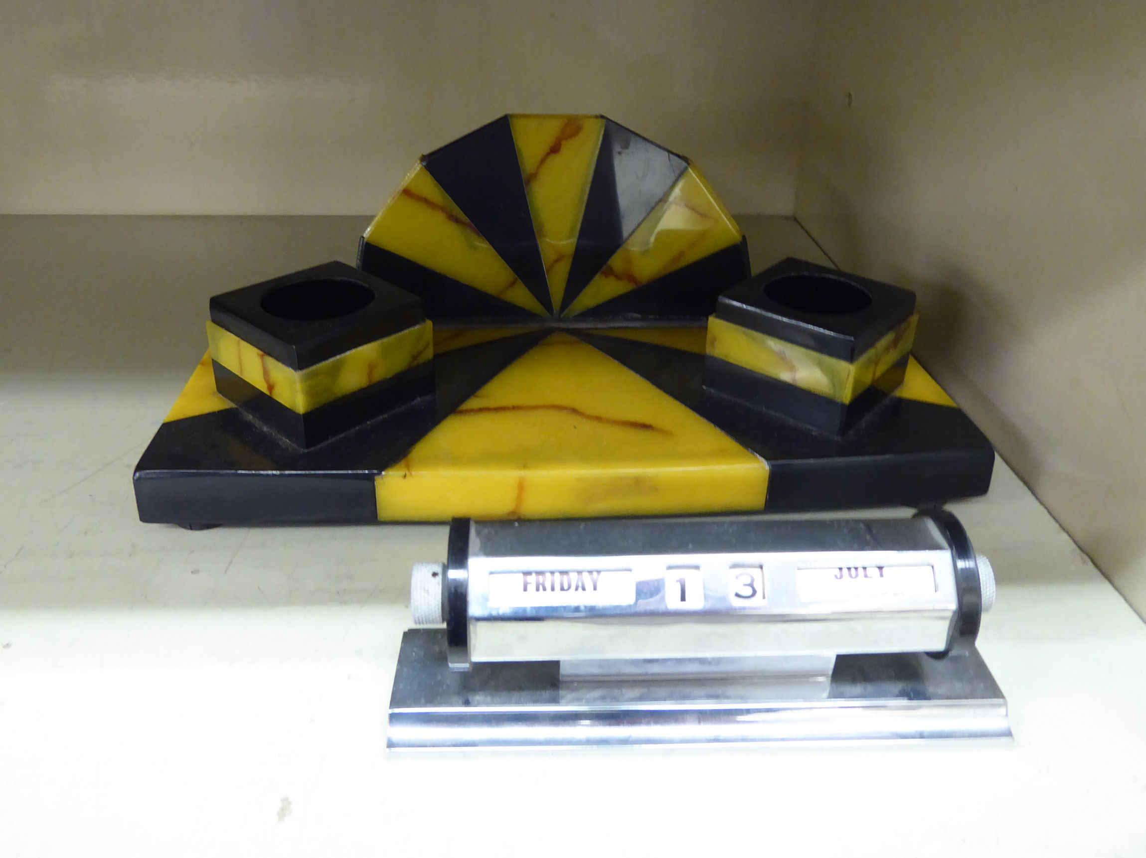 A 1930s Art Deco resin deskstand with pen holders and two inkwells 9''w;