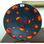 A Poole pottery 'lava' charger 16''dia CA