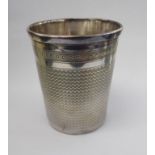 An early 20thC Continental silver beaker with engine turned decoration bears indistinct marks