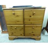 A modern pine four drawer filing cabinet,