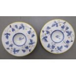 A pair of Italian Maiolica footed bowls, decorated with birds and flora, in blue,