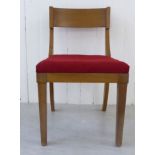 A mid 20thC TH Robsjohn-Gibbings satin mahogany framed bedroom chair with a curved bar back and red