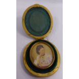 A late 19thC half-length portrait miniature, a woman holding a pair of binoculars, in a glazed,