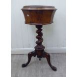 A late Victorian walnut work table of octagonal form with a hinged lid,