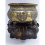 A late 18th/early 19thC Chinese bronze censor of squat, bulbous form,