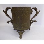 A late 19th/early 20thC Asian bronze jardinere of wide cylindrical form with engraved ethnic