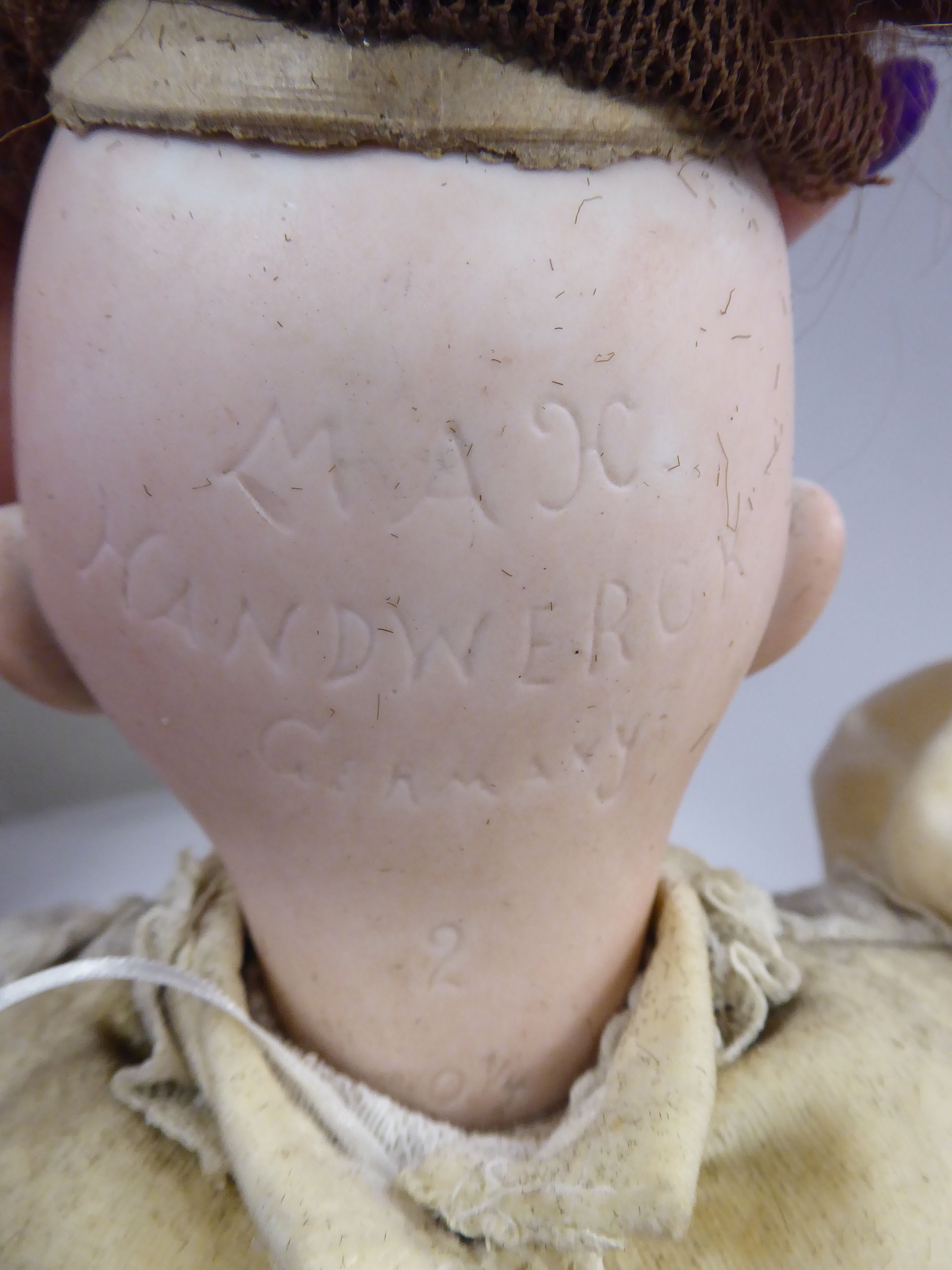 A Max Handwerck porcelain head doll with painted features and weighted, sleeping eyes, - Image 4 of 5