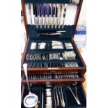 A part canteen of silver flatware and cutlery, comprising table forks and knives,