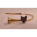 A gold coloured metal novelty bangle, fashioned as a hunting horn,