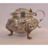 An early Victorian silver lidded mustard pot of squat, bulbous form, decorated with floral,