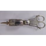 A George III silver scissor action wick trimmer/candle snuffer with cast gadrooned and foliate