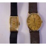 A lady's 1930/40s Omega yellow metal cased wristwatch, faced by a yellow Arabic dial,