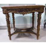A mid 19thC gilded and carved centre table with an oval pink and cream marble top,