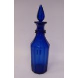 A mid 19thC Bristol blue glass decanter and stopper with a multi-faceted body 13.