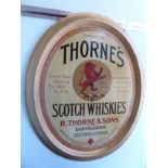 A 'vintage' press metal advertising sign for Thorne's Scotch Whiskey 35'' x 29''