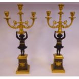 A pair of mid 19thC Empire style cast and patinated and lacquered gilt bronze candelabra,