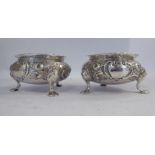 A pair of mid Victorian silver salt cellars, the shallow bowls with flared rims,